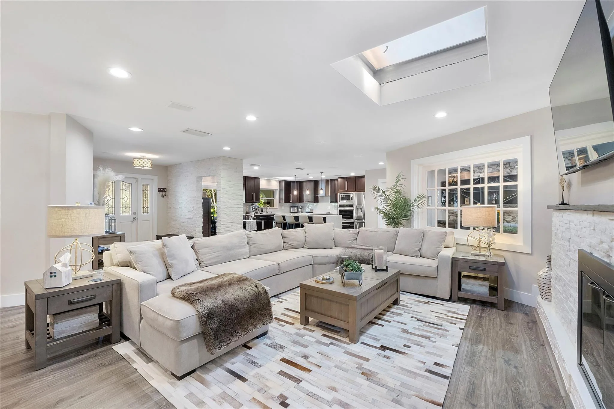 One of the pretty living areas with the skylight that brings sunshine into the home,(furniture negotiable)