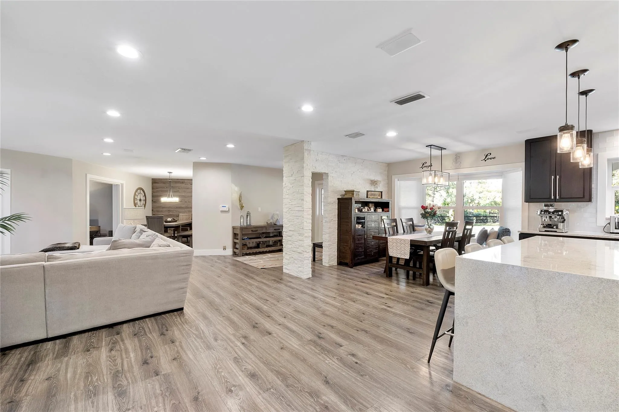 The spacious living room is open to the Piano room, The formal dining room, The kitchen and the casual dining room, plus the prettiest informal dining room and social room that leads to your own private office overlooking the pool & gardens