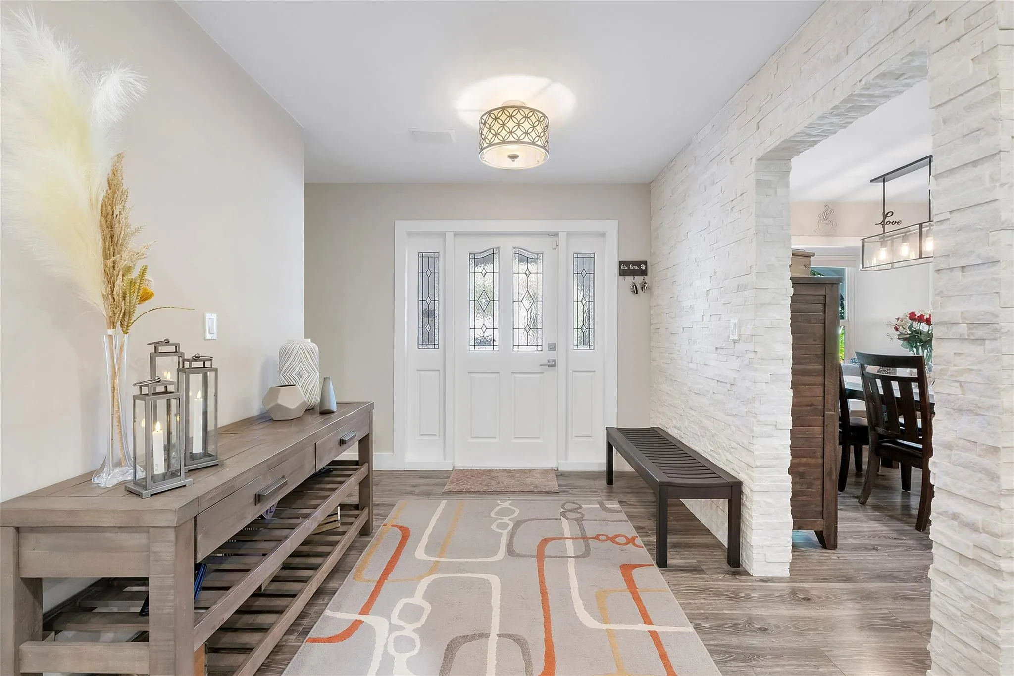 As you enter this doorway you are met with a sprawling open floor plane of areas for all the family combined, This is the interior entryway as you come into the​​‌​​​​‌​​‌‌​‌‌​​​‌‌​‌​‌​‌​​​‌​​ home,