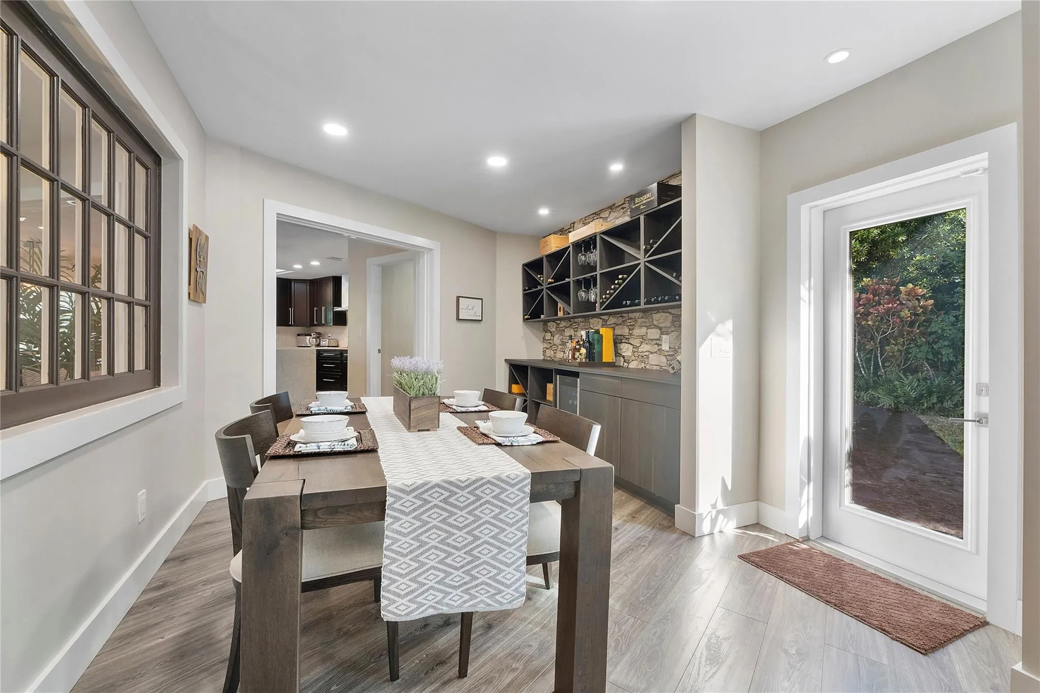 This pretty room is such a favorite place in the home, Although it is just open to the living room it can still be the quiet reading room or an extra dining room for the children at Thanksgiving dinner or Holidays, with windows on both sides the sunshine is always shining