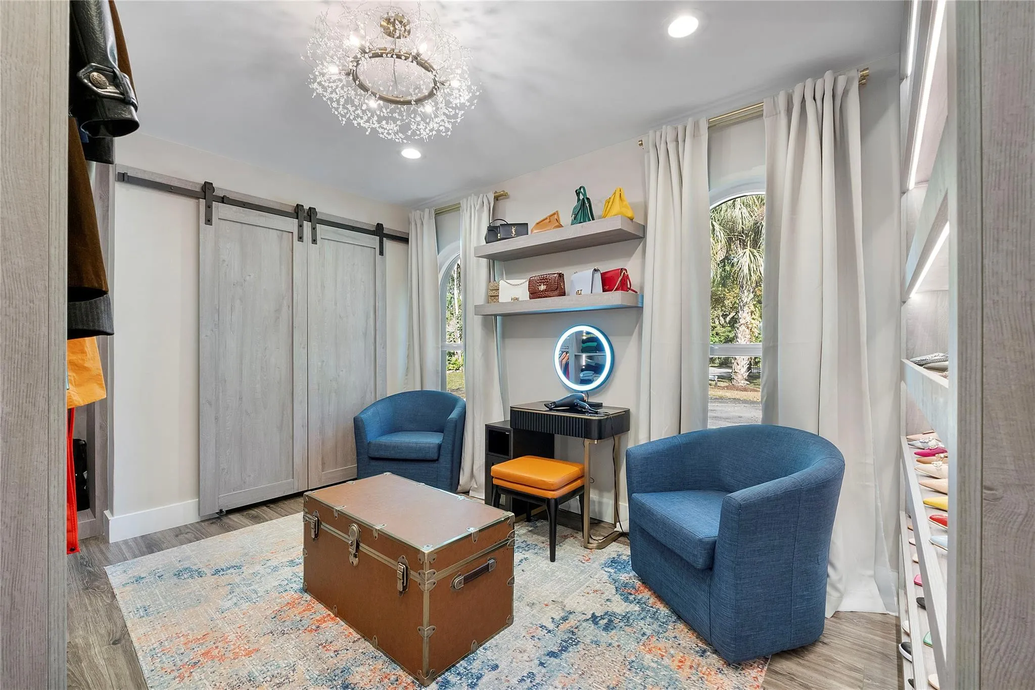 This elegant designer bedroom has Italian designer custom closets for fashion designer purses & shoes,