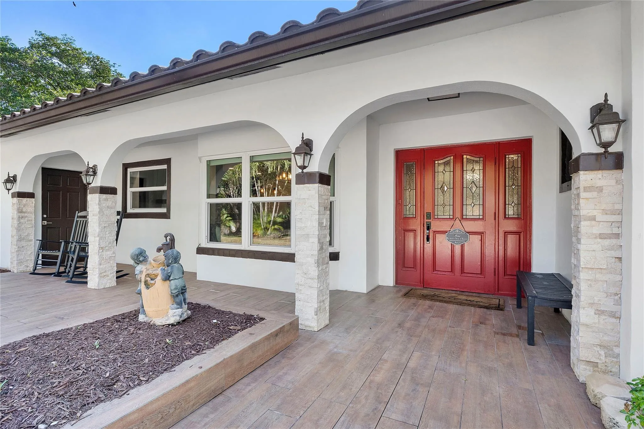 The front porchway, So inviting, The front garden also has a large area that is all fenced and gated, Its fun to watch the wildlife or your kids playing, great area for a baseball pitch.