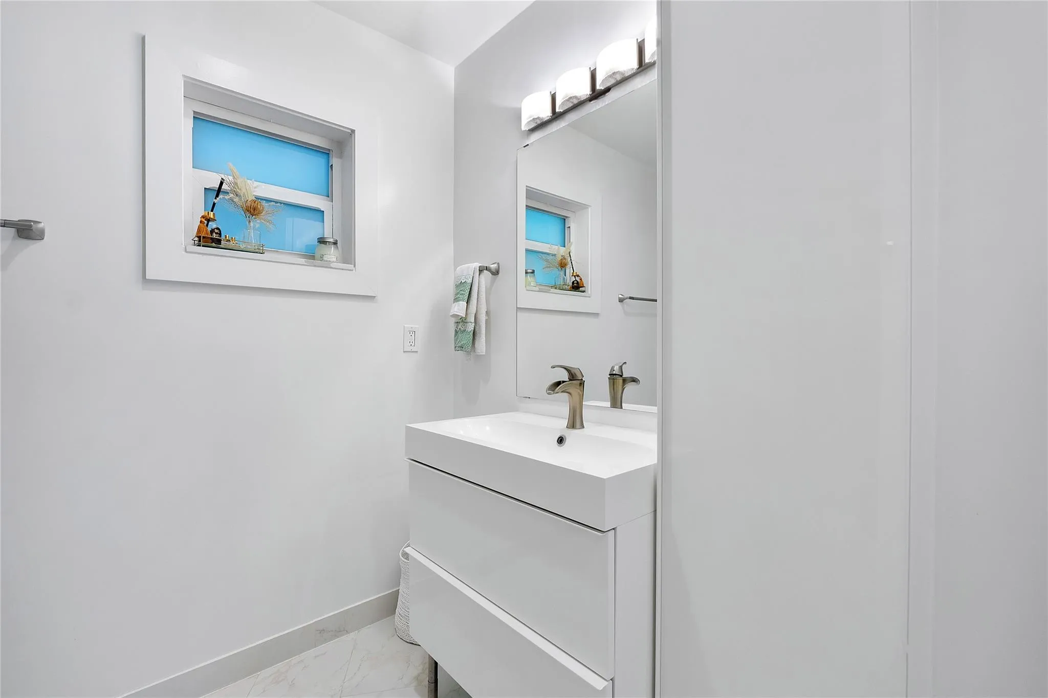 One of the guest bathrooms all in white ready for you to add some color in towels and decor