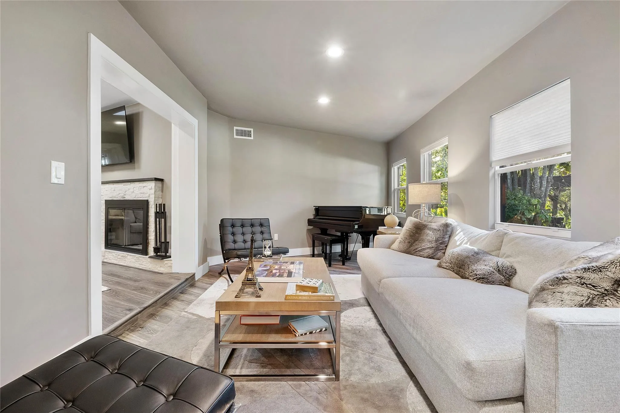 This is not just one of the many living rooms, The sellers call this room their 'Piano room" because they have a beautiful piano in this pretty room and they use this room as the delightful music flows thought the house and its open floor plan from this situated piano area,