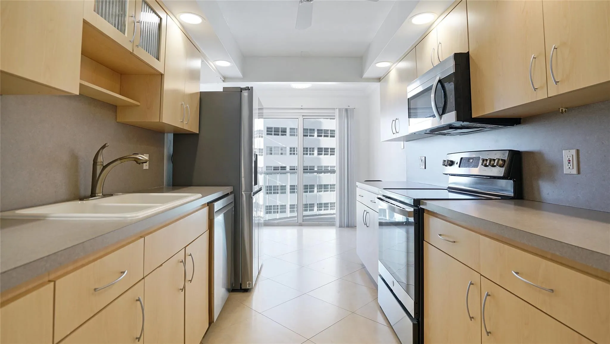 The sliding glass doors lead out to the balcony.