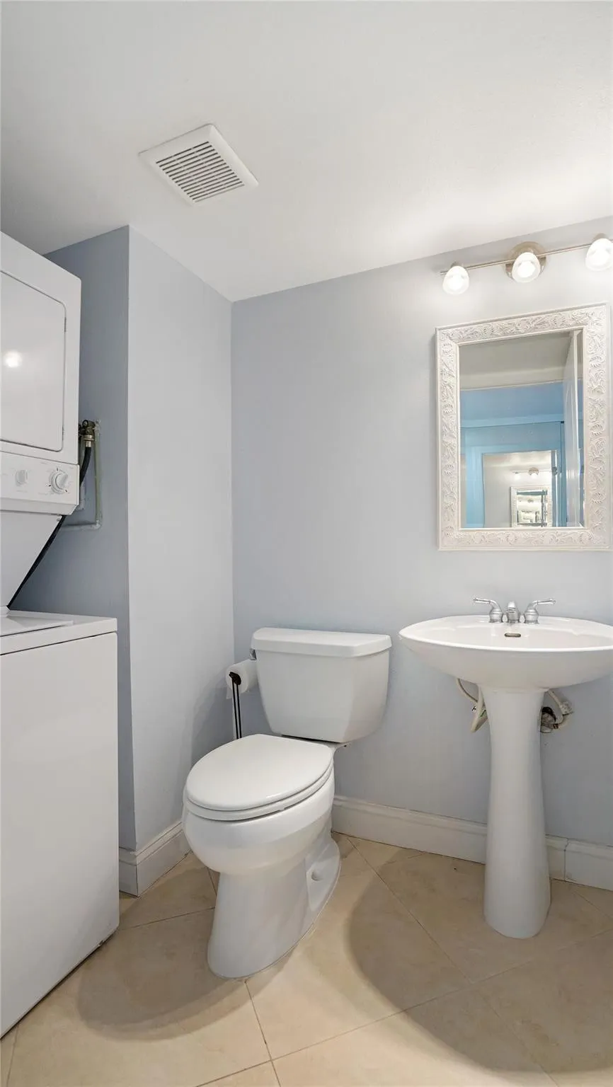 The washer and dryer is in the half bathroom.