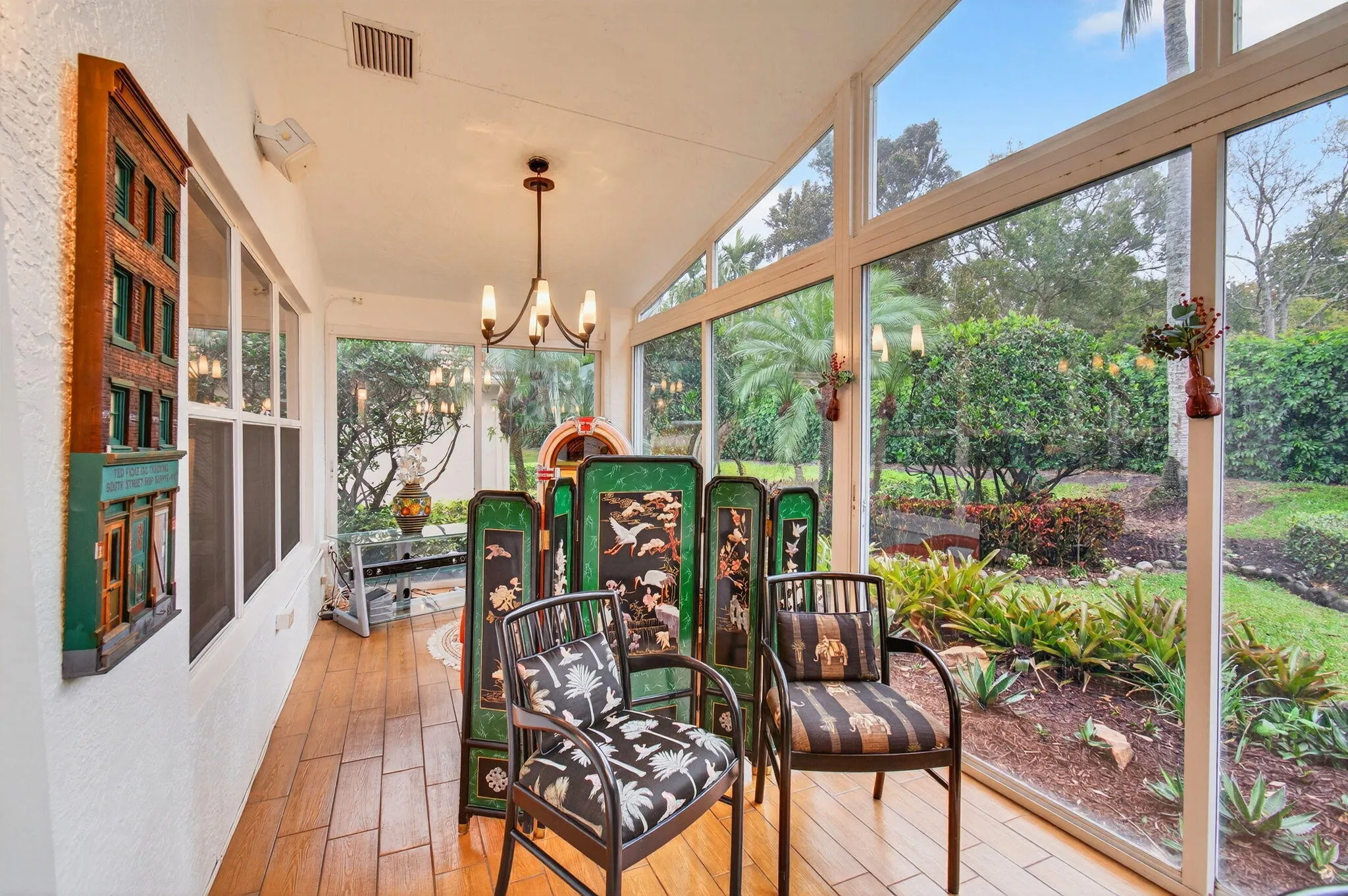 Wide lanai can be utilized for lounging; a music listening area lies beyond the dining area
