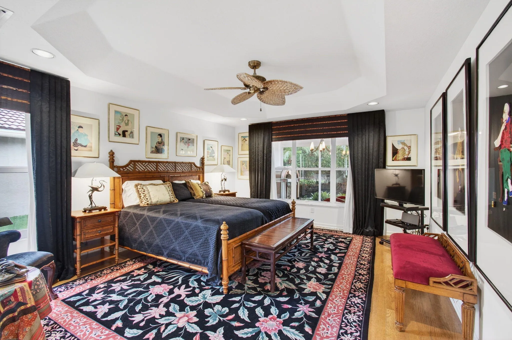 Primary Bedroom on the left side of the home is spacious and light