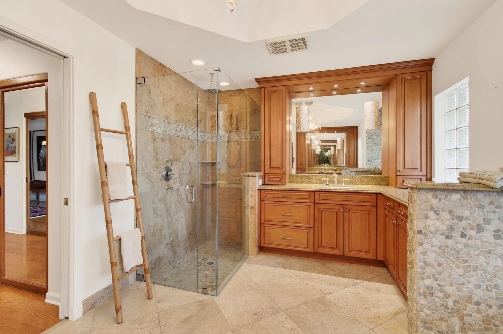 Roll-in shower, double vanities with ample storage