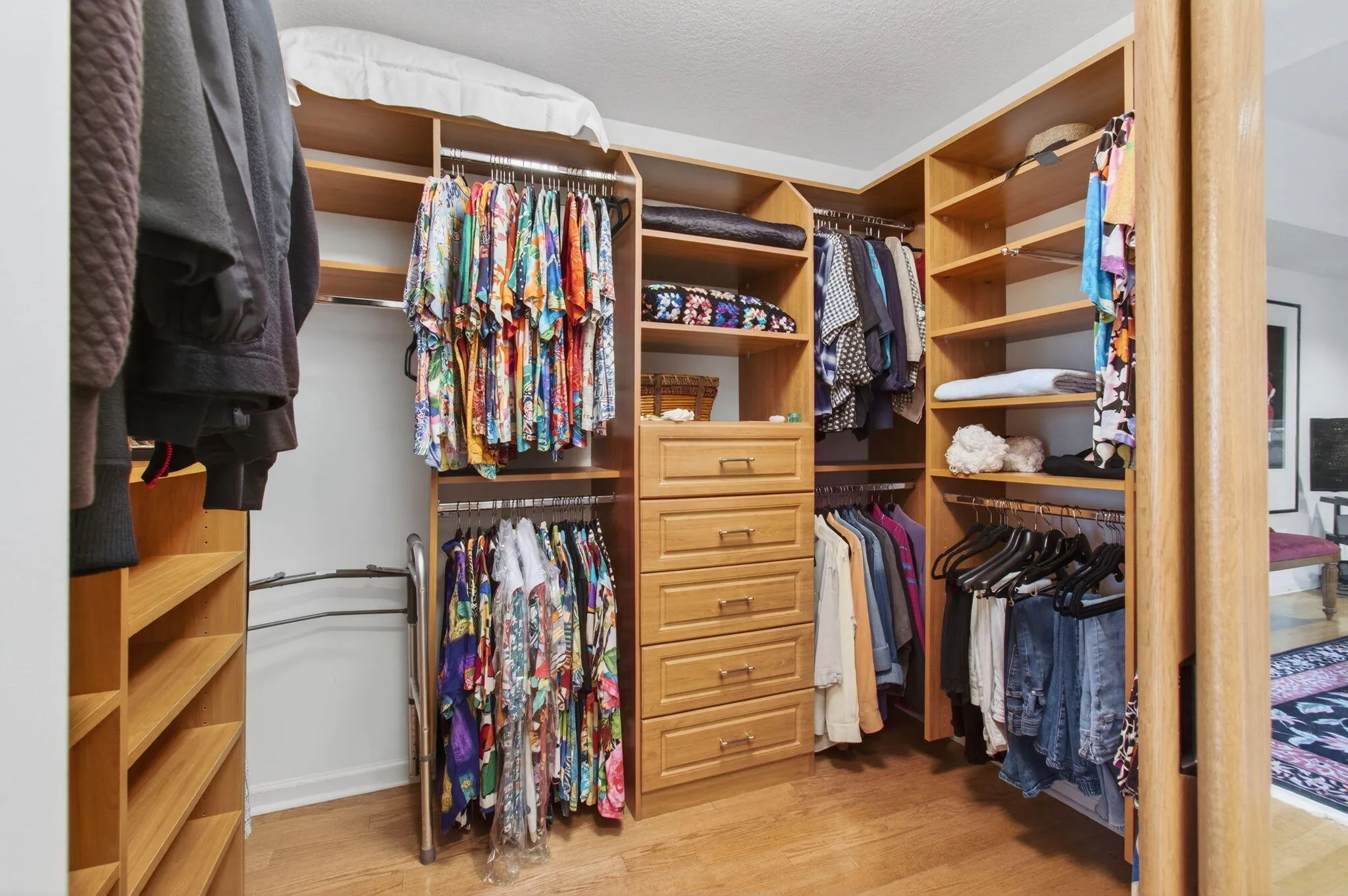 Closets are fully outfitted with storage and hangar rods