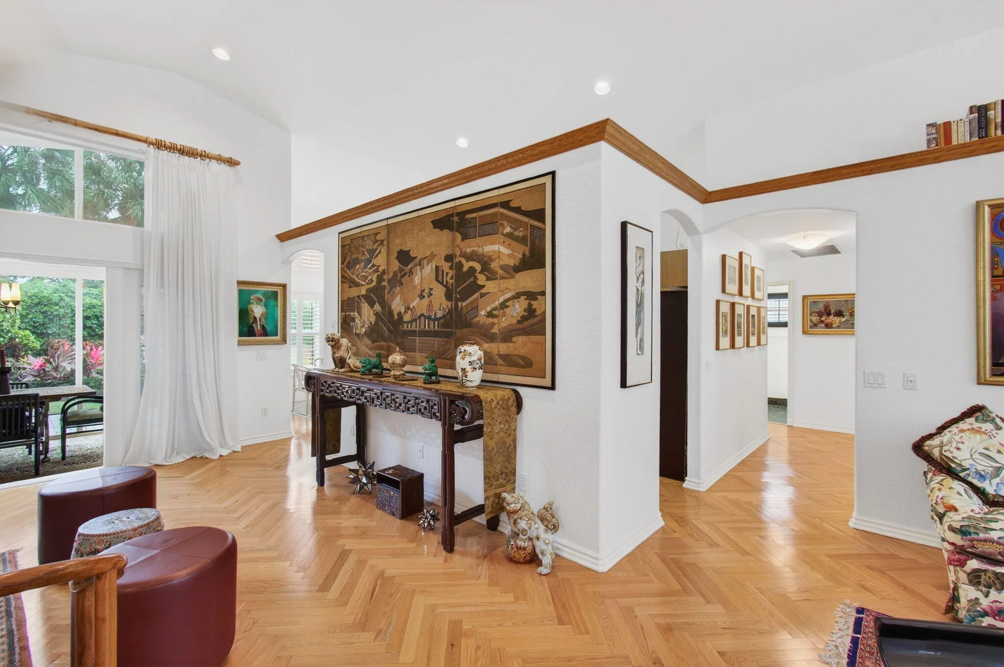 Right-hand hallway leads to guest bedrooms and bath