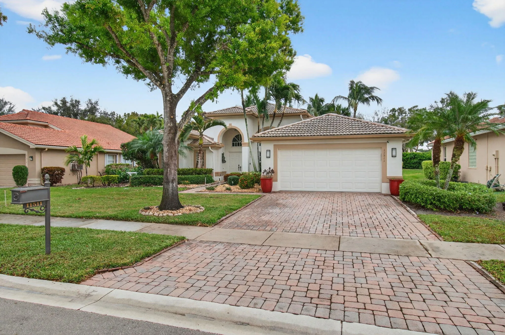 The oversized garage easily accommodates two vehicles as does the wide driveway