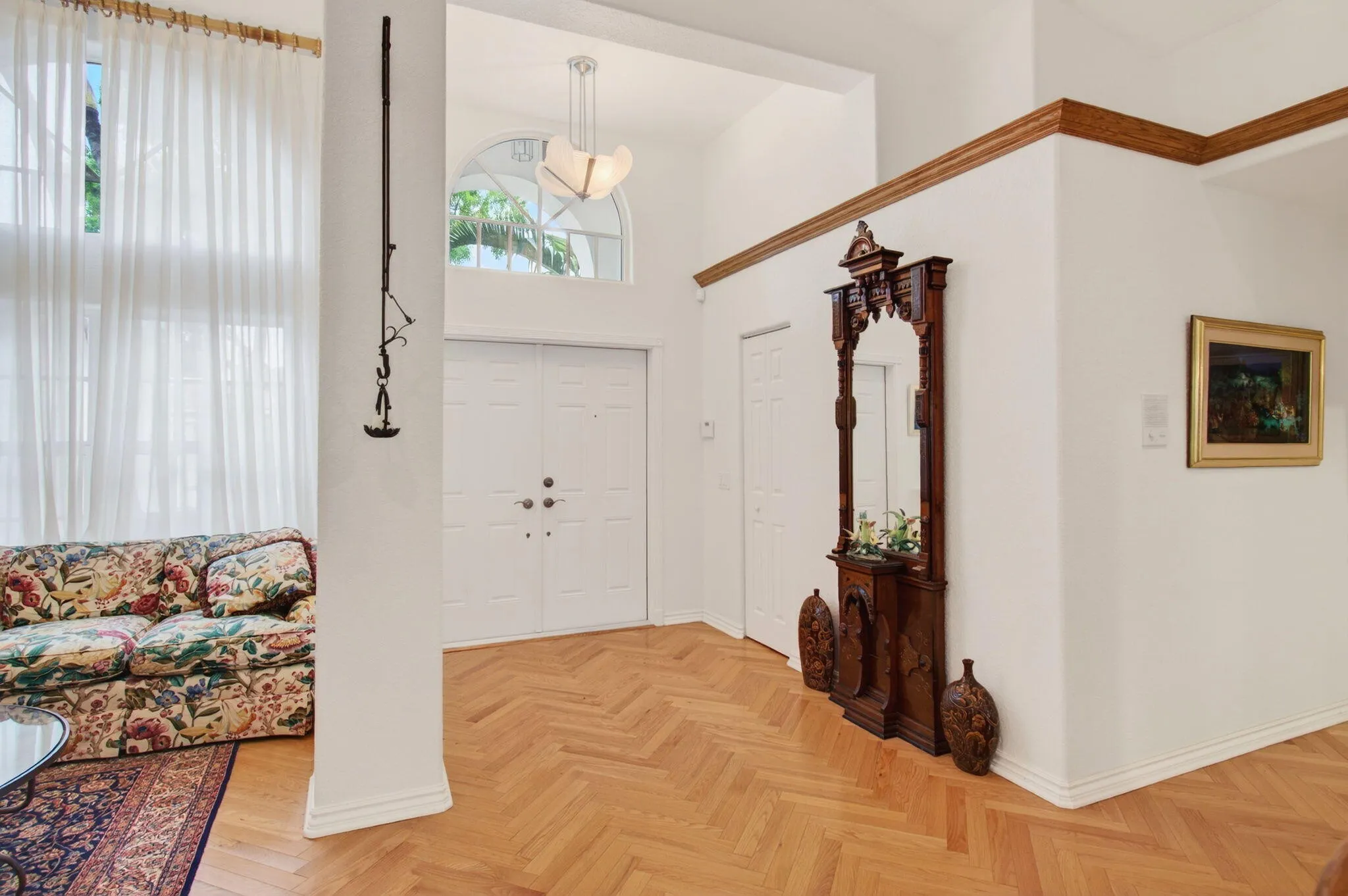 The Foyer opens to the Living and Dining areas.