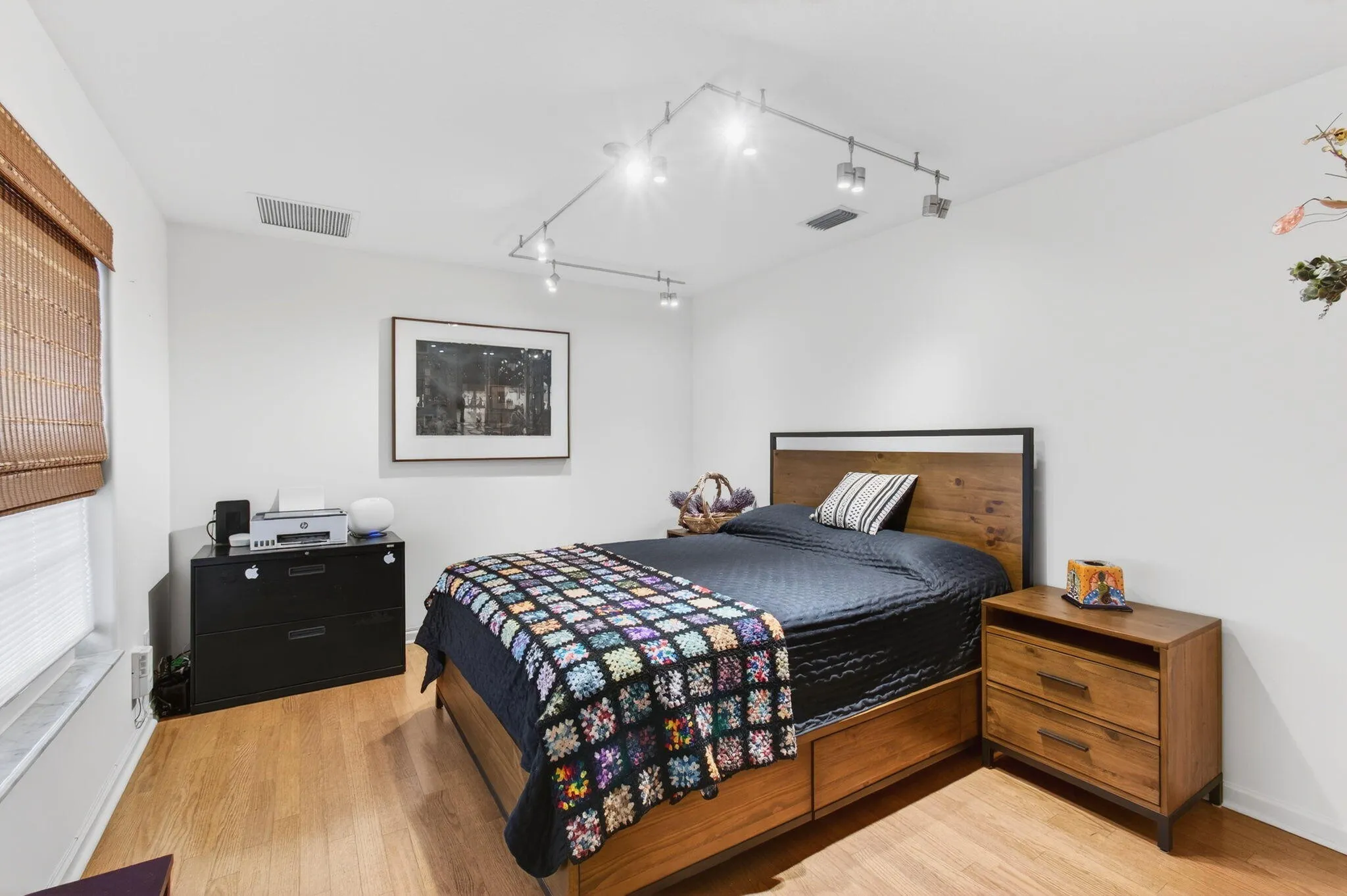 Bedroom 2 features contemporary track lighting