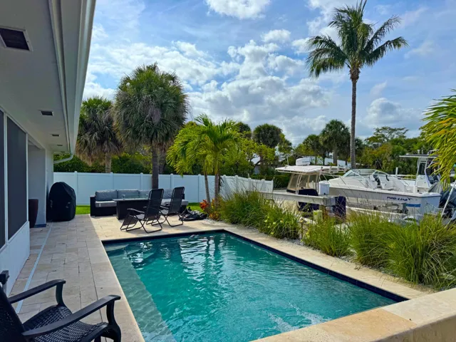 Overlooking an expansive yard and boat dock