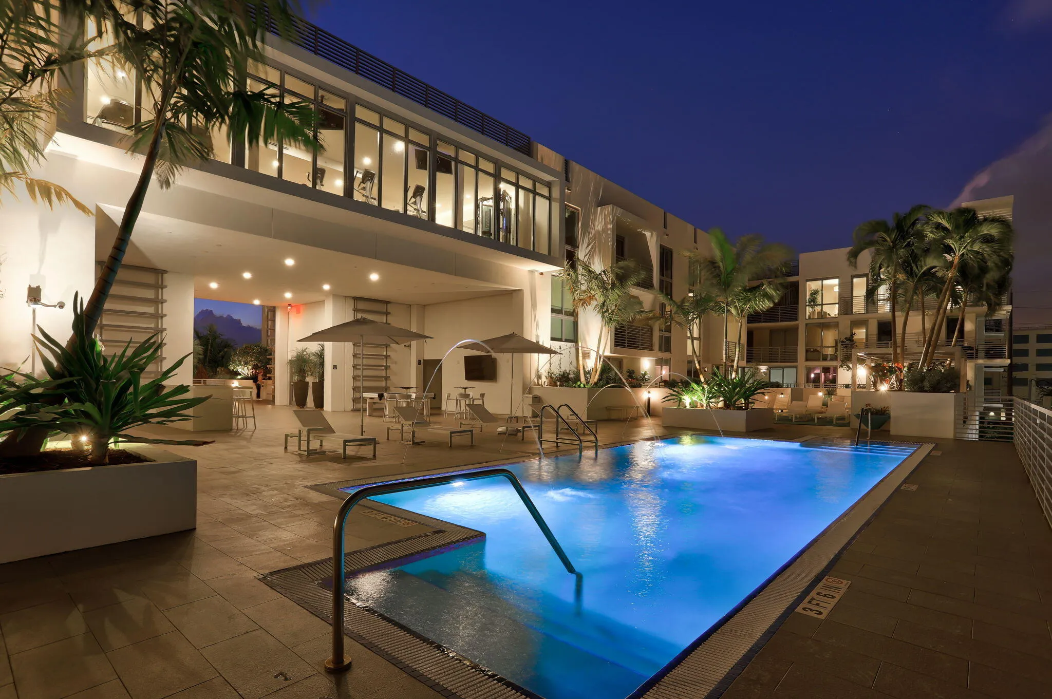 Twilight view of pool