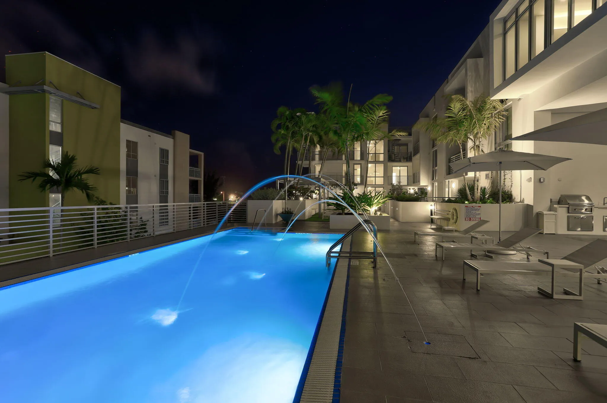 Twilight view of pool