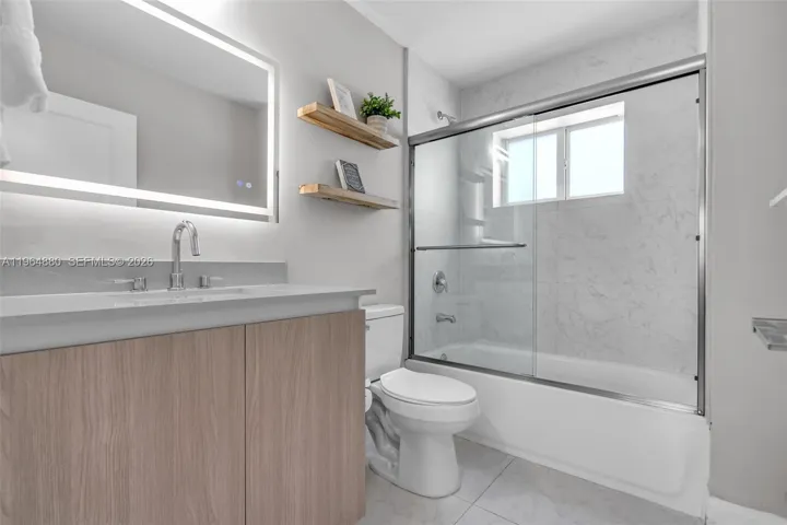 GUEST BATHROOM WITH COMBINATION TUB WITH SHOWER