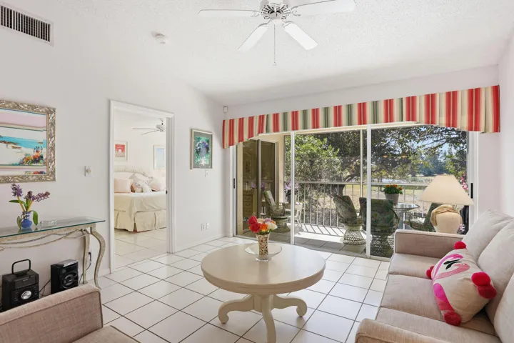 Facing screened balcony and primary bedroom
