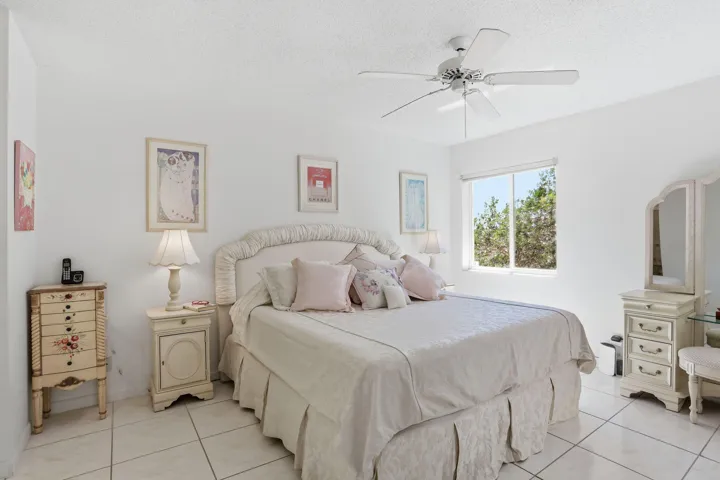 Large sun filled Primary bedroom with access to private balcony