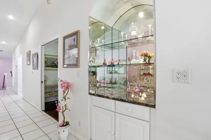 Multiple glass shelves and storage cabinets below