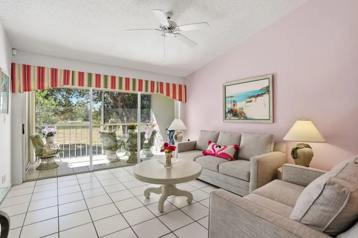 Facing private screened in balcony with serene and beautiful nature and golf course views