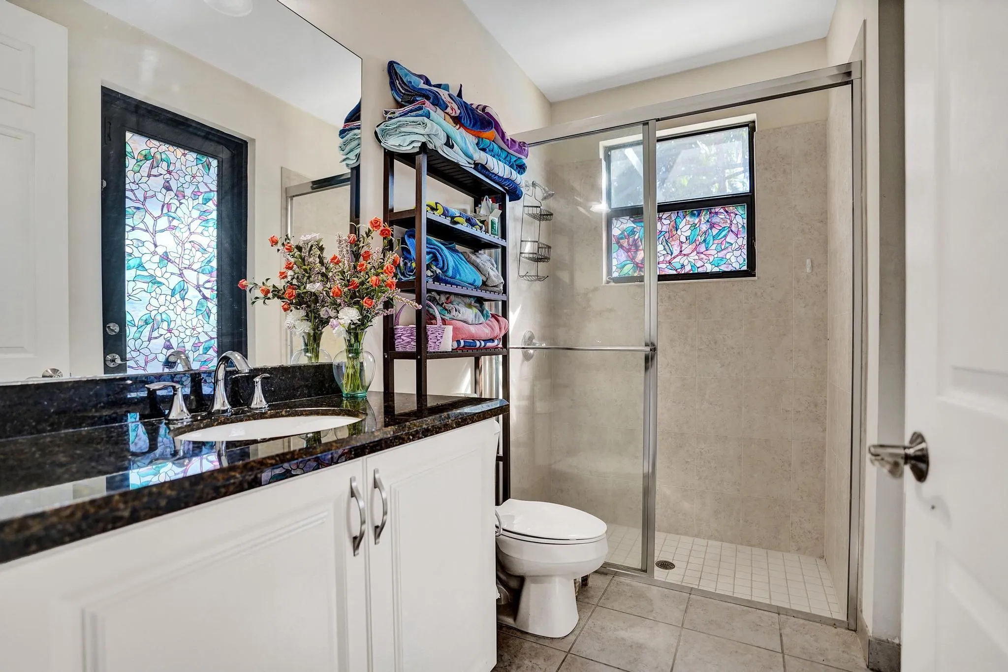 Full bath serves as cabana bath to pool and family room