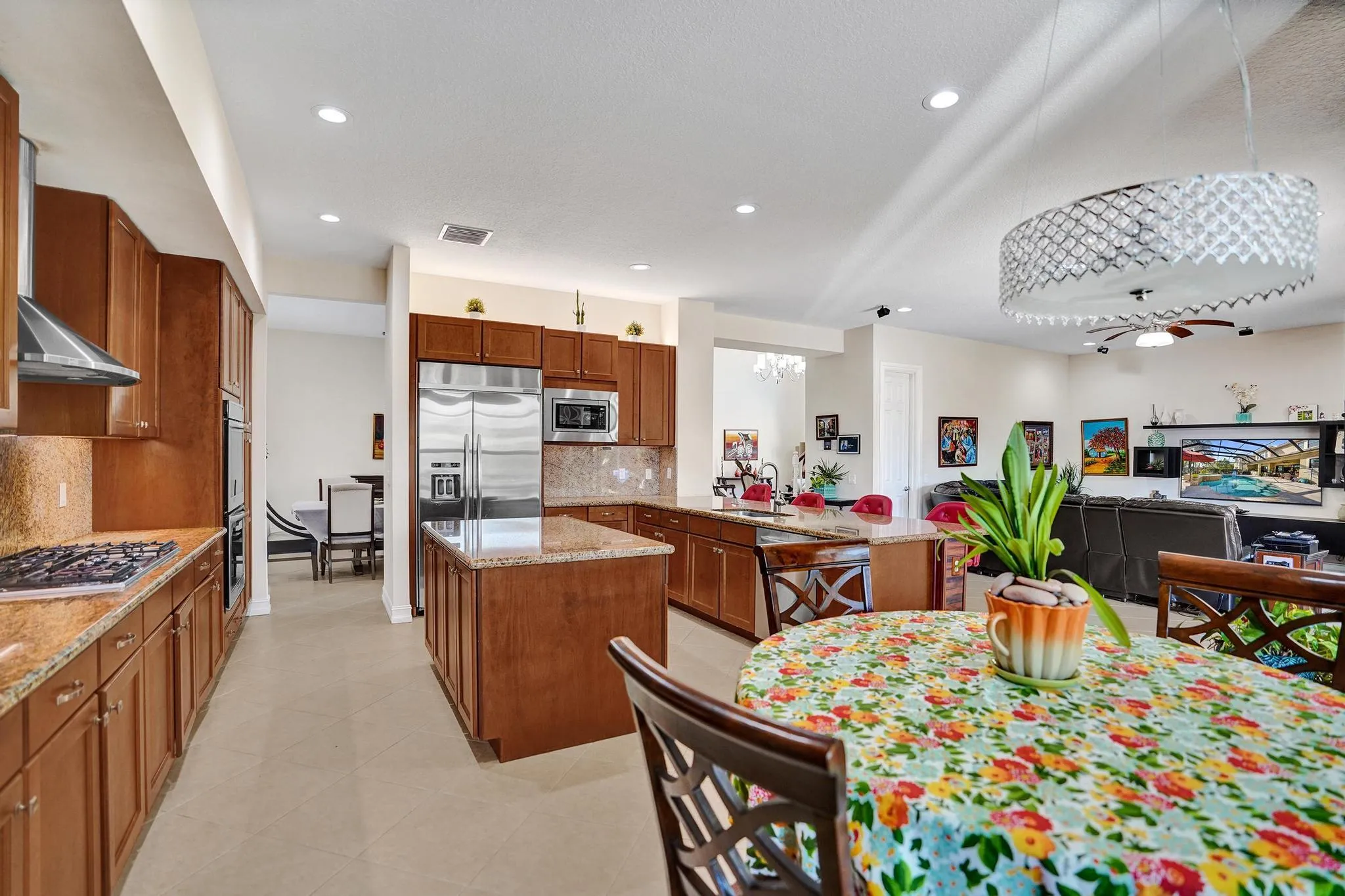 Gas Stove top, double oven, island, granite counters and stainless appliances