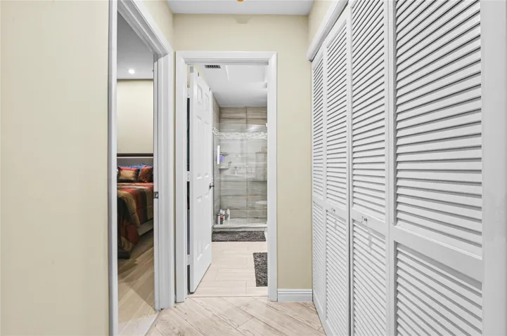 Hallway closet at entry to guest bedroom and bath