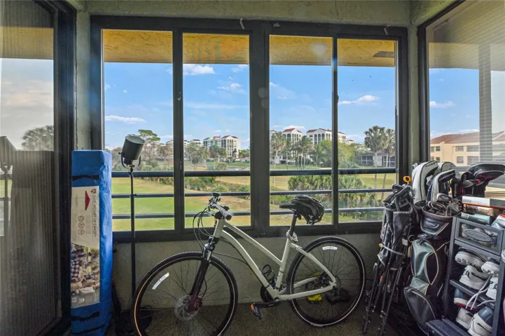 Additional patio in kitchen area great storage for golf clubs with lake and golf view