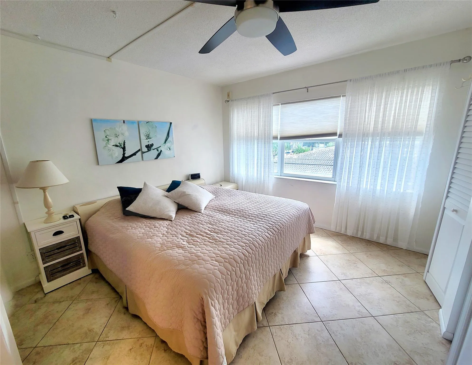 Main bedroom w/ hurricane windows