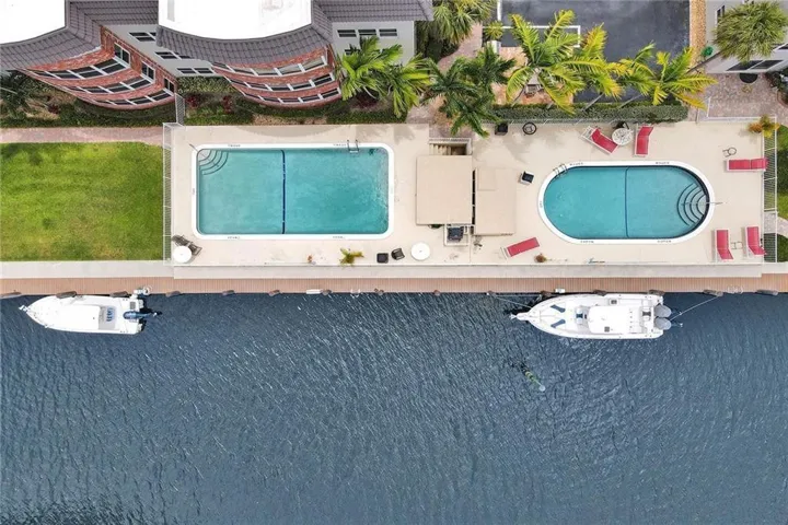 COASTAL LIVING AT ITS BEST FOR BEACH & BOAT LOVERS IN LAUDERDALE BY THE SEA. THIS NICELY REMODELED UNIT FEATURES 1300 SQ FT, 2 BEDROOMS 2 BATHROOMS LOCATED DIRECTLY ON THE CANAL W/ AMAZING WATER VIEWS ONLY 600 FT FROM THE INTRACOASTAL. KITCHEN FEATURES WHITE SHAKER CABINETS, STAINLESS STEEL APPLIANCES W/ GRANITE COUNTERTOPS, & IN UNIT WASHER/ DRYER. PRIMARY BEDROOM ALSO HAS WATER VIEWS W/ WALK IN CUSTOM CALIFORNIA STYLE CLOSET. UPDATED BATHROOMS, NO FIXED BRIDGES, 3 HEATED POOLS, 3 BBQ AREAS, TIKI HUT.