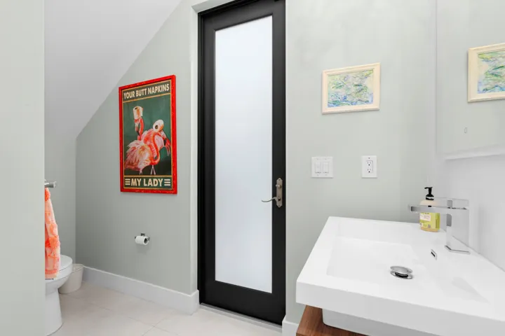 1st Floor Powder Room below staircase