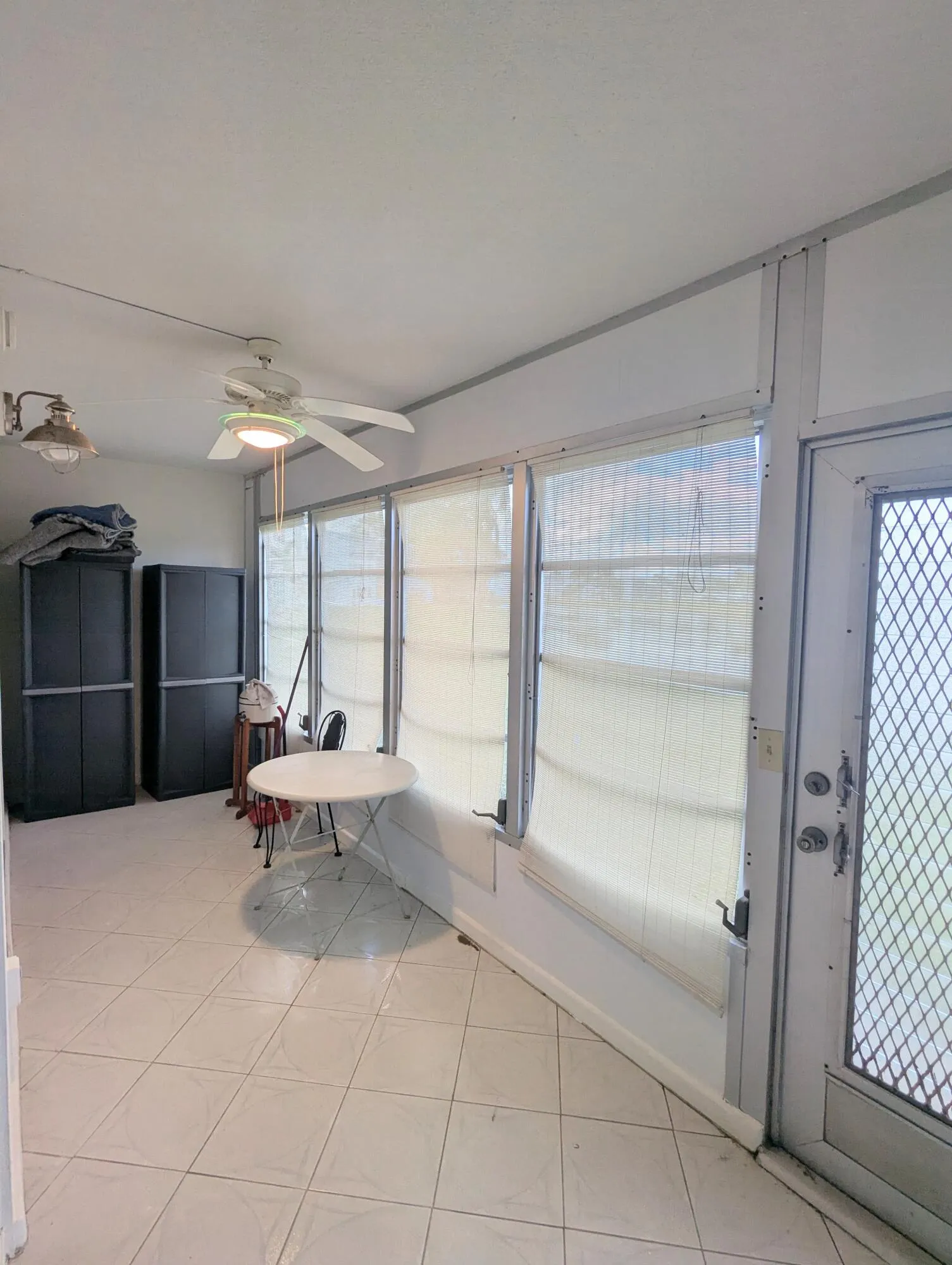 Large Tiled Enclosed Patio with Lake Views