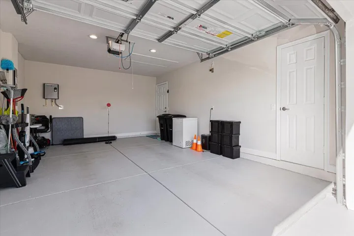 Spacious garage offers room for your vehicle plus additional storage, tools, or hobby space.