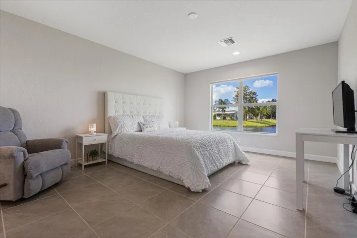 Spacious primary suite designed for comfort with plenty of room for a sitting area.