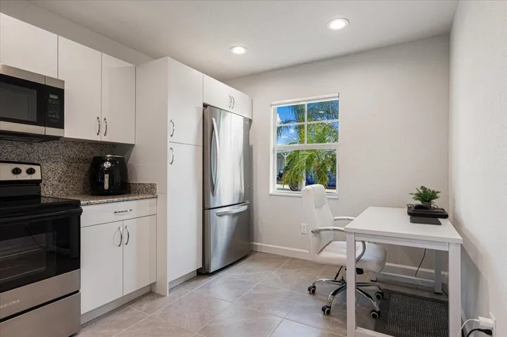 Versatile space adjacent to the kitchen, ideal for casual dining, a breakfast nook, or a convenient home office.