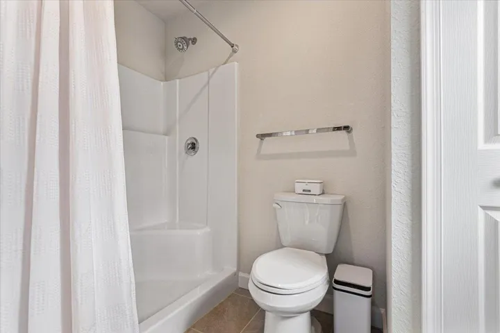Thoughtfully designed walk-in shower offers comfort, convenience, and easy maintenance.