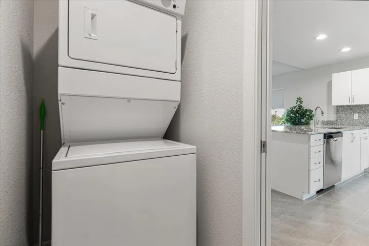 Full-size indoor laundry with easy access and added convenience.
