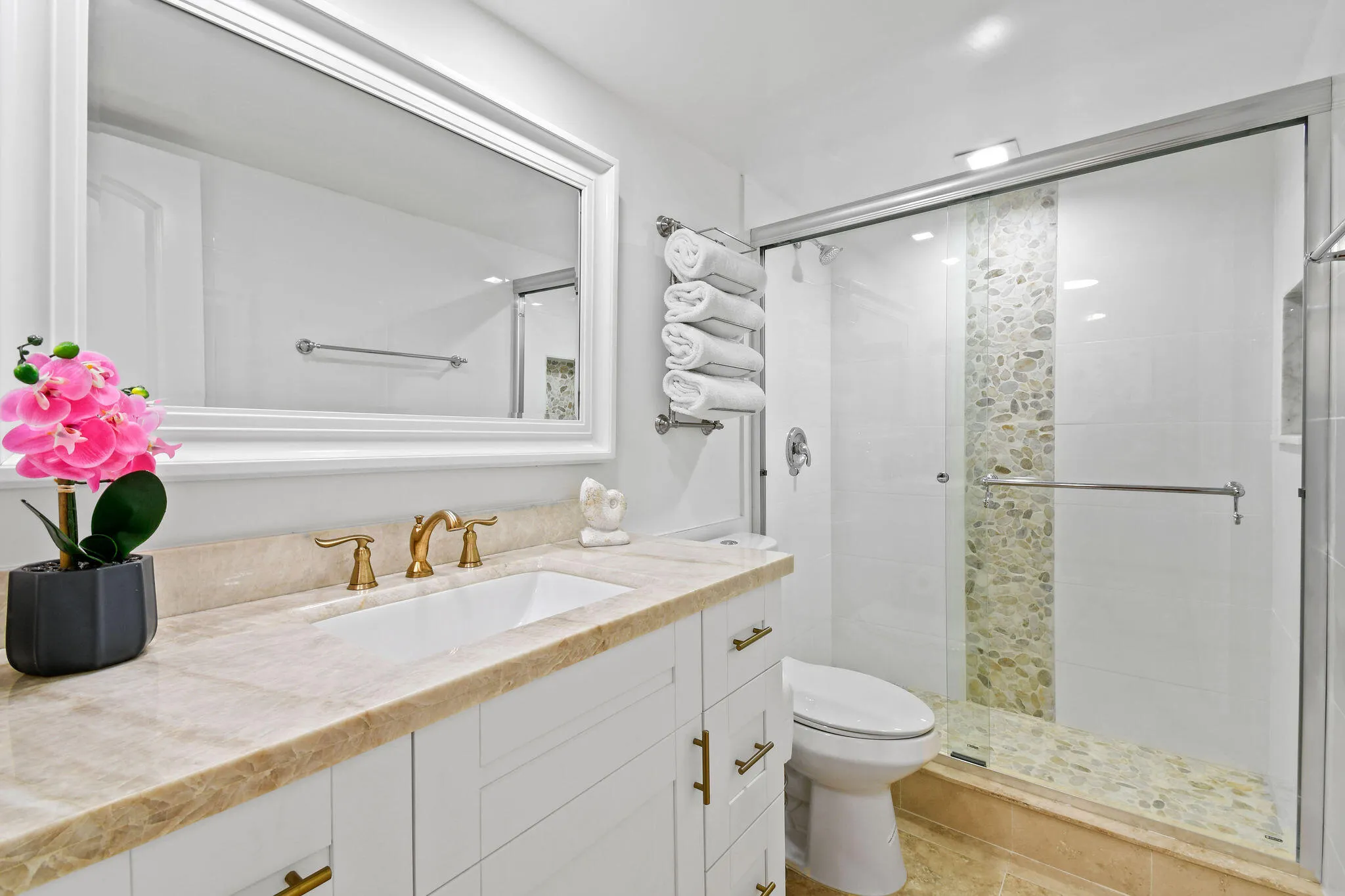 BRIGHT, WHITE SECONDARY BATHROOM WITH CUSTOM TILED SHOWER, TOWEL HOLDER, & INTALIAN MARBLE COUNTERTOP