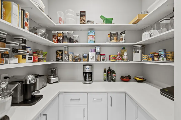 Walk In pantry with custom cabinets
