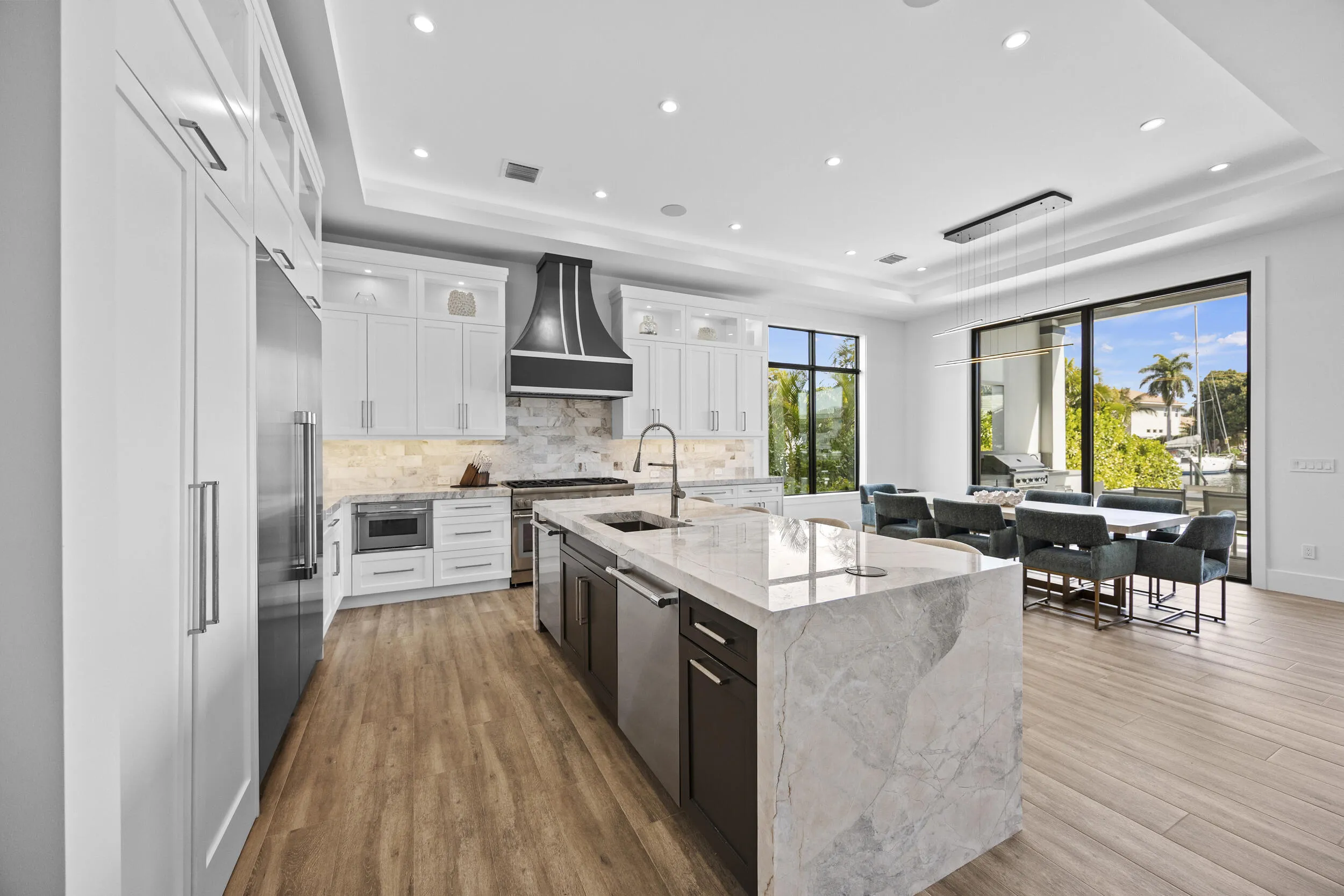 Quartzite Waterfall Thick Edge Island with dual Thermador dishwashers