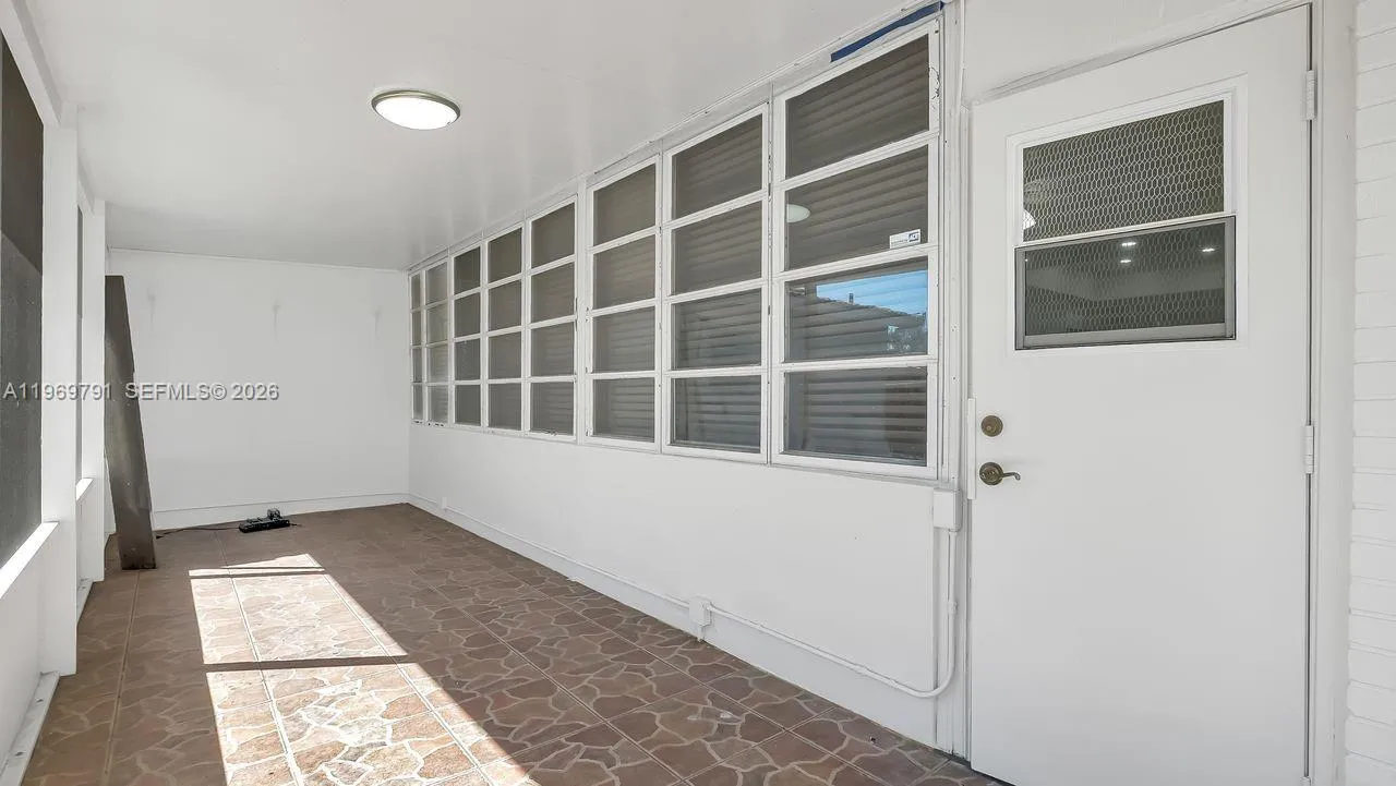 Screened-patio is shared by both sides of the home.