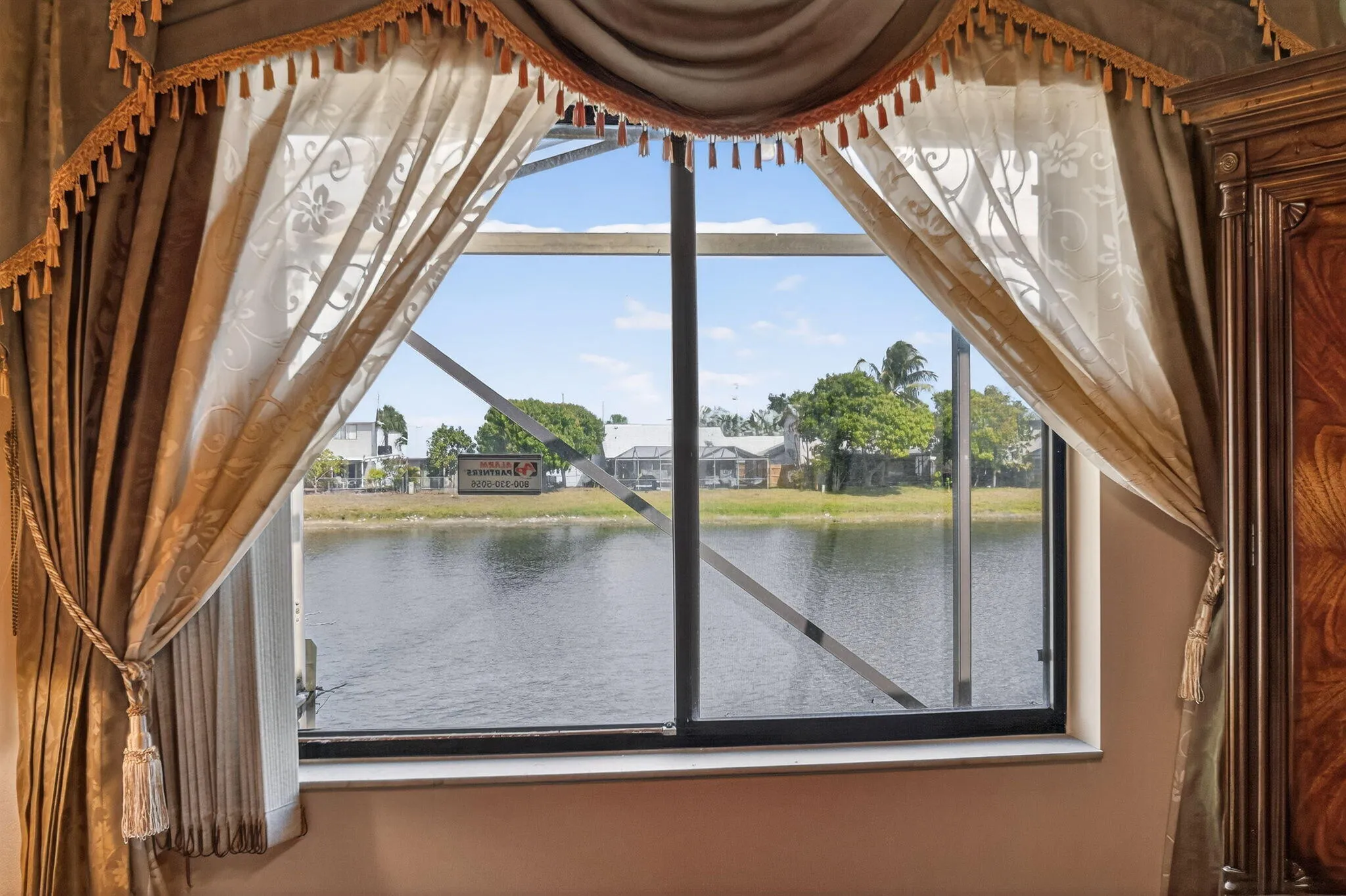 Peaceful water view from the primary bedroom