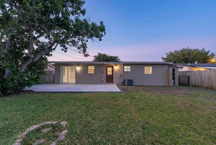 Rear of home & Oversized Backyard!