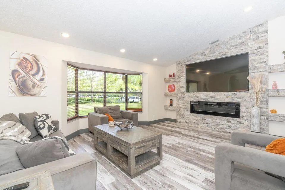 Living Area open floor plan with fresh paint, new flooring, and abundant natural light.