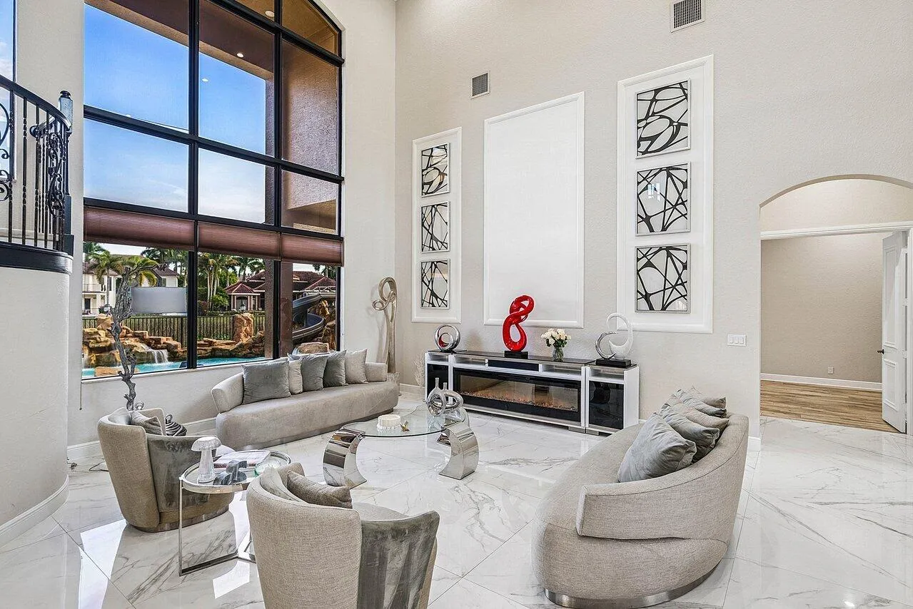 Soaring windows overlook the pool