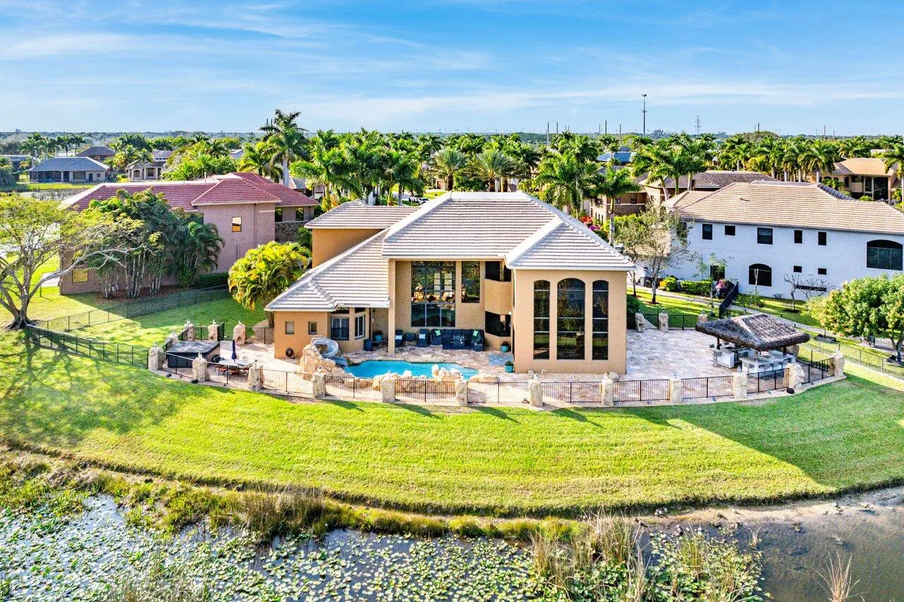 17,000 sq ft fenced lot, grassy area on southside and outdoor kitchen
