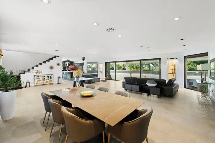First floor living room with kitchen, bathroom, bar, and 2 offices.