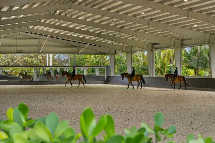 One of Broward's largest covered indoor arenas with sprinklers, lighting, and professional footing. (100' x 200')